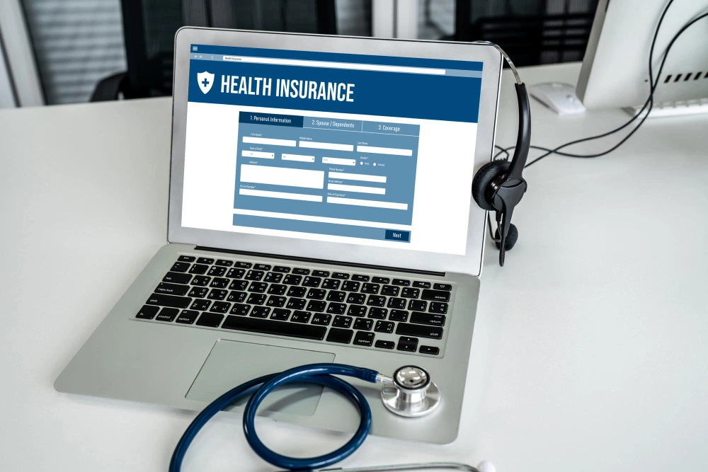 laptop displaying health insurance information 